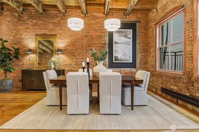a view of a deck with table and chairs with wooden floor and fence