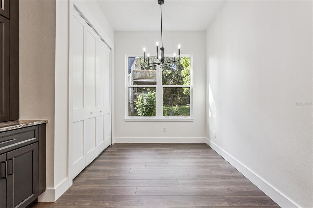 17540 3rd Street Montverde, FL 34756 - Photo 17 of 80 a view of an empty room with wooden floor and a window
