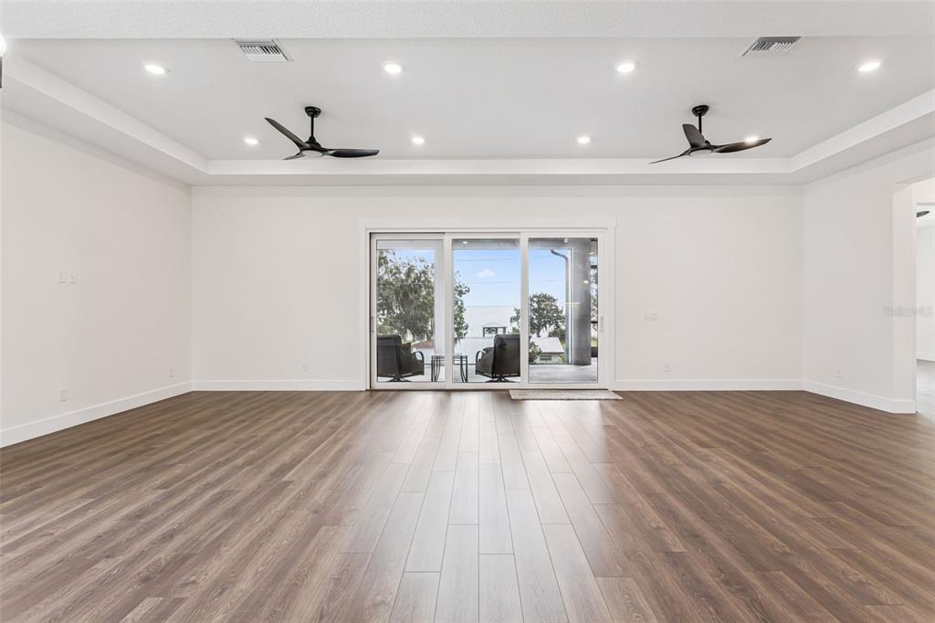 17540 3rd Street Montverde, FL 34756 - Photo 21 of 80 a view of an empty room with wooden floor and a window