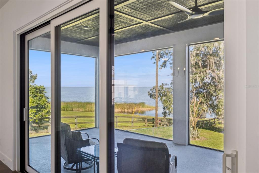 17540 3rd Street Montverde, FL 34756 - Photo 42 of 80 a view of a hallway with furniture and garden