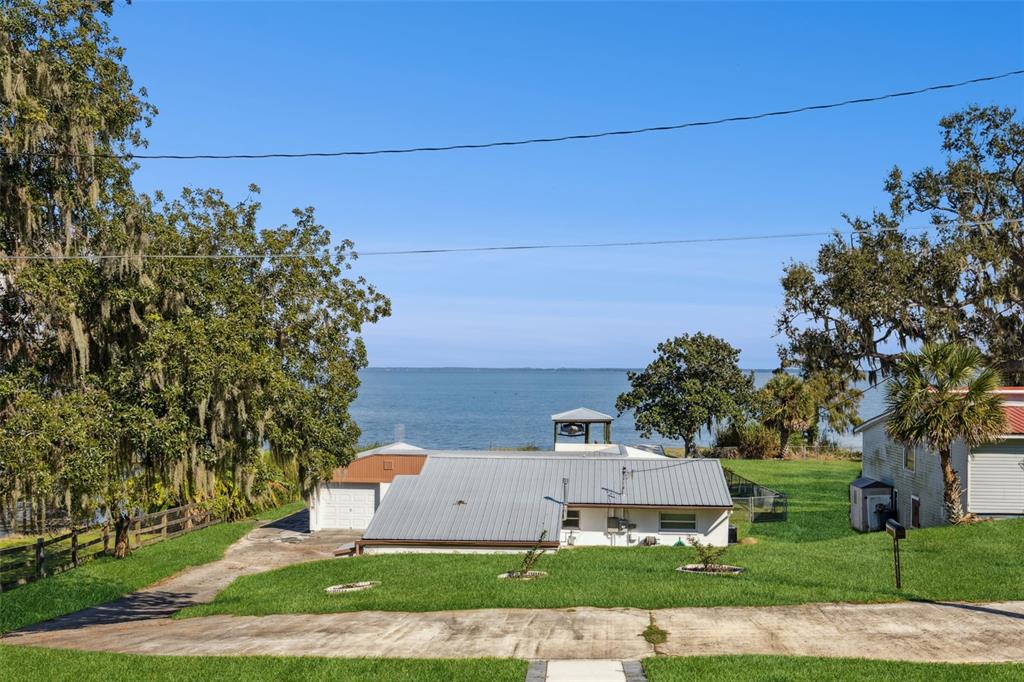 17540 3rd Street Montverde, FL 34756 - Photo 52 of 80 an aerial view of a house with a yard and large tree