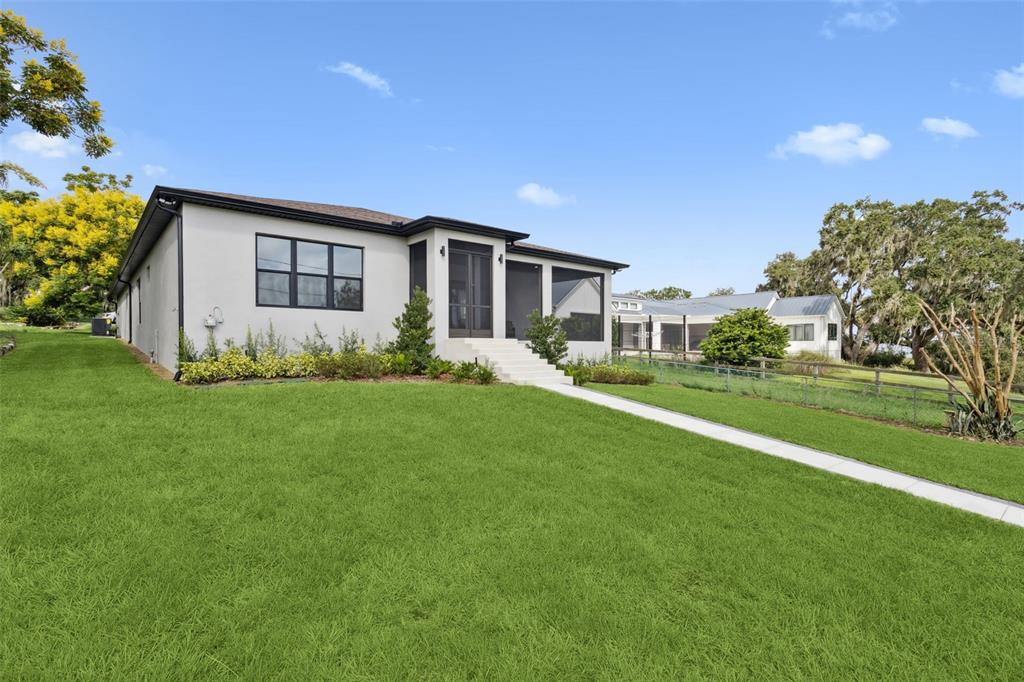 17540 3rd Street Montverde, FL 34756 - Photo 57 of 80 a front view of a house with garden