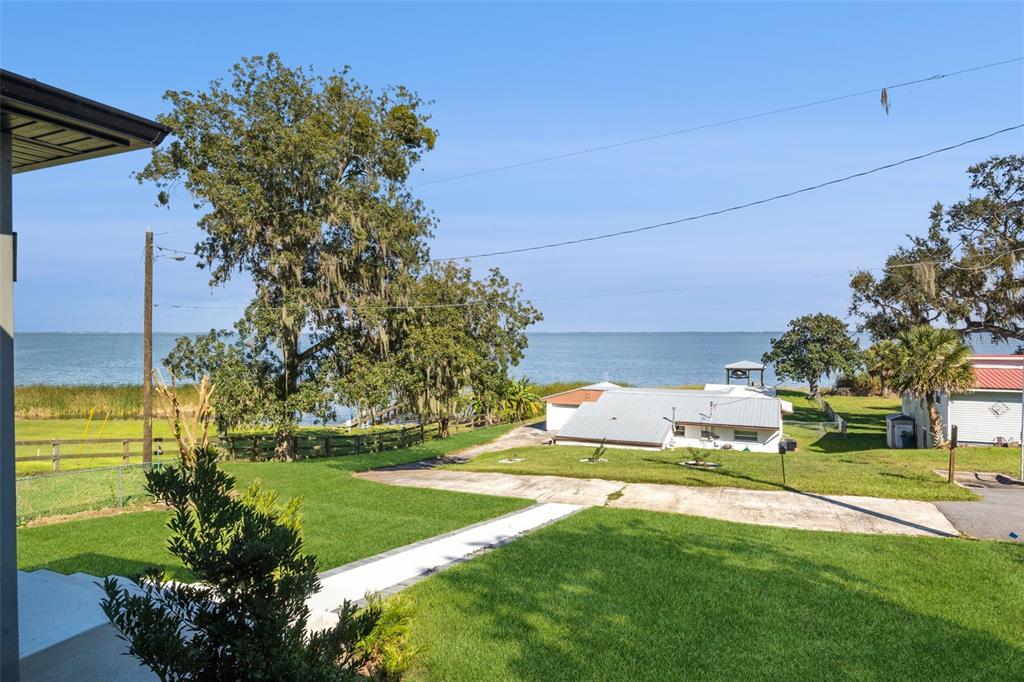 17540 3rd Street Montverde, FL 34756 - Photo 62 of 80 a view of a house with a big yard and a large tree