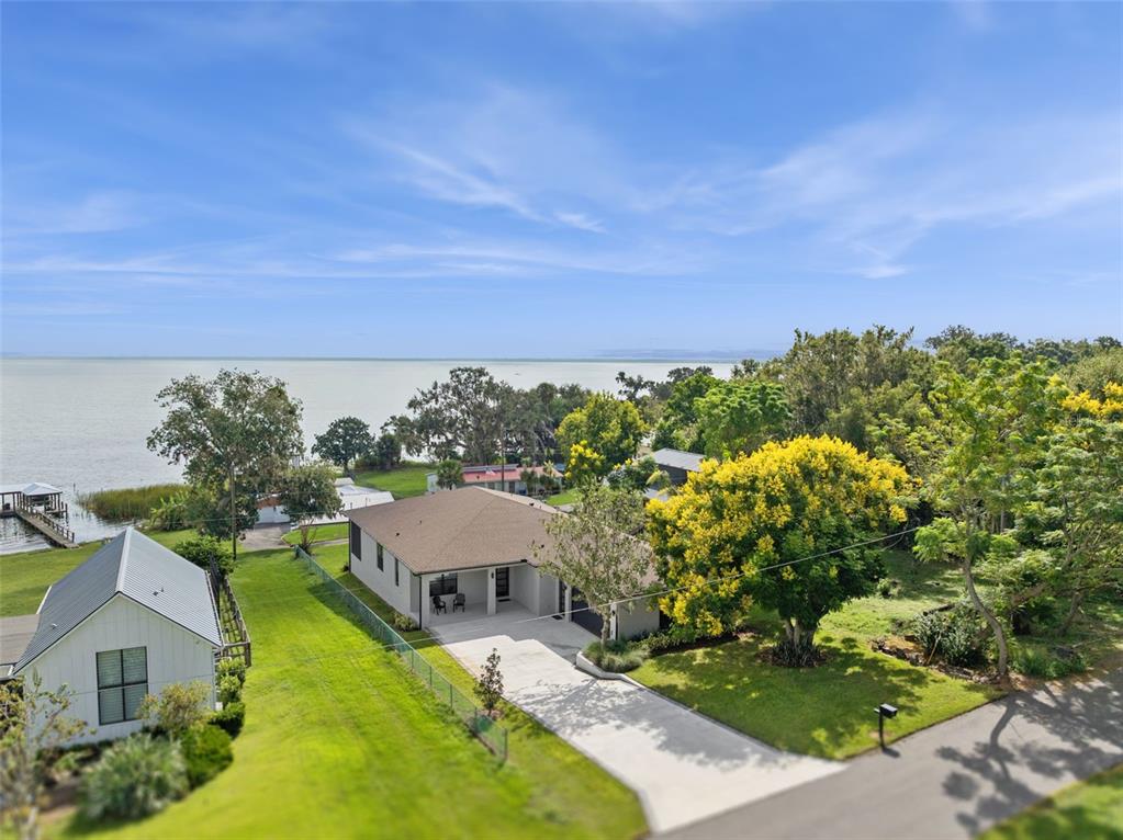 17540 3rd Street Montverde, FL 34756 - Photo 68 of 80 an aerial view of a house with a yard basket ball court and outdoor seating