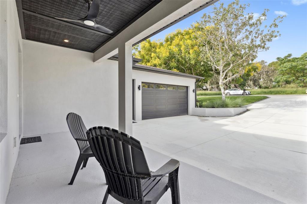 17540 3rd Street Montverde, FL 34756 - Photo 9 of 80 a view of a porch with furniture and a yard