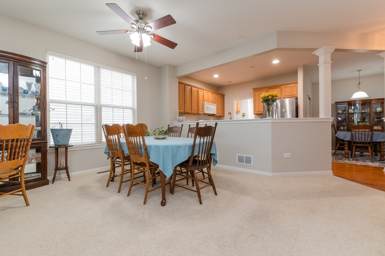 13822 Chestnut Lane Huntley, IL 60142 - Photo 11 of 43 a view of a dining room with furniture and a chandelier