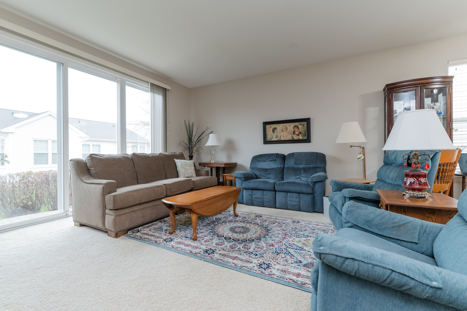 13822 Chestnut Lane Huntley, IL 60142 - Photo 13 of 43 a living room with furniture and a large window