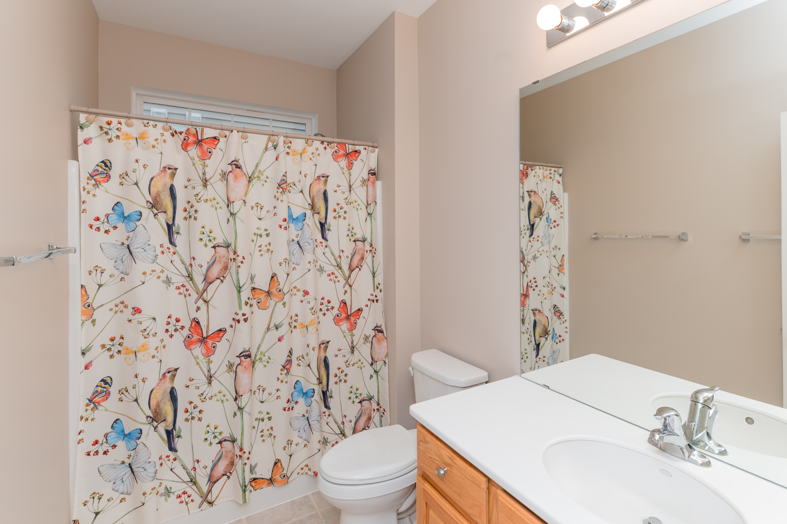 13822 Chestnut Lane Huntley, IL 60142 - Photo 16 of 43 a bathroom with a sink toilet and shower curtain