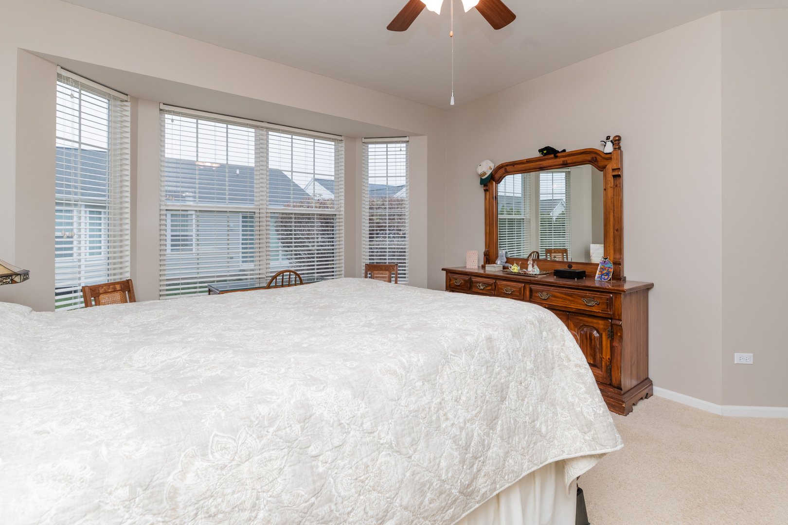 13822 Chestnut Lane Huntley, IL 60142 - Photo 20 of 43 a bedroom with a bed and a large window