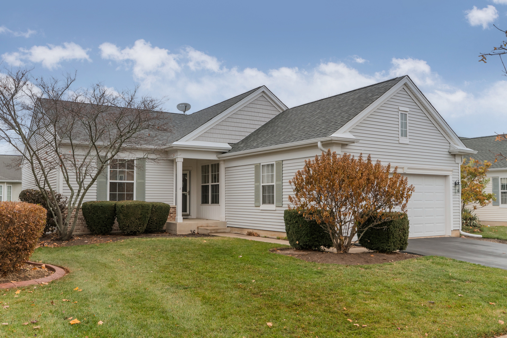 13822 Chestnut Lane Huntley, IL 60142 - Photo 2 of 43 a front view of a house with a yard