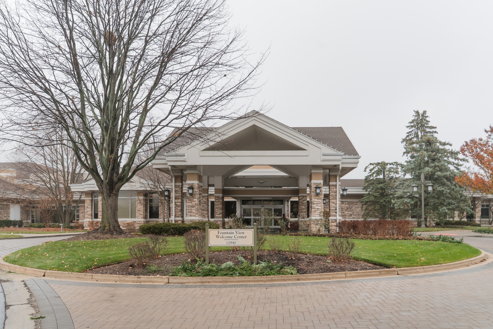 13822 Chestnut Lane Huntley, IL 60142 - Photo 32 of 43 a front view of a house with a garden