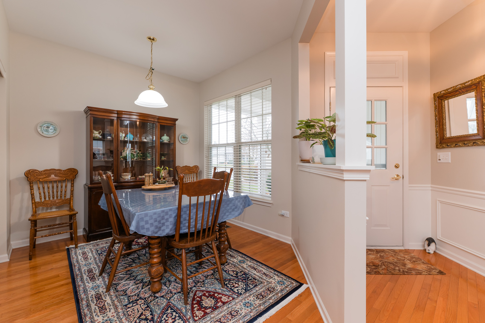 13822 Chestnut Lane Huntley, IL 60142 - Photo 6 of 43 a view of a dining room with furniture window and wooden floor