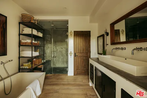 a view of a house with swimming pool and sitting area