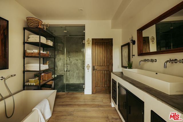 a view of a house with swimming pool and sitting area