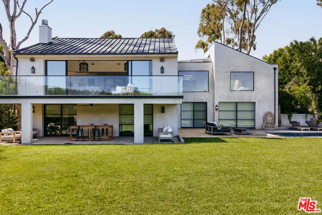 a view of a couches in the patio and a fountain