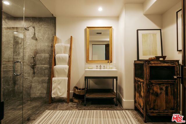 a view of a house with a big yard and large trees