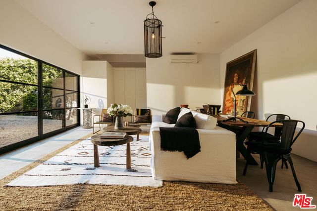 a view of a chair and table in the patio