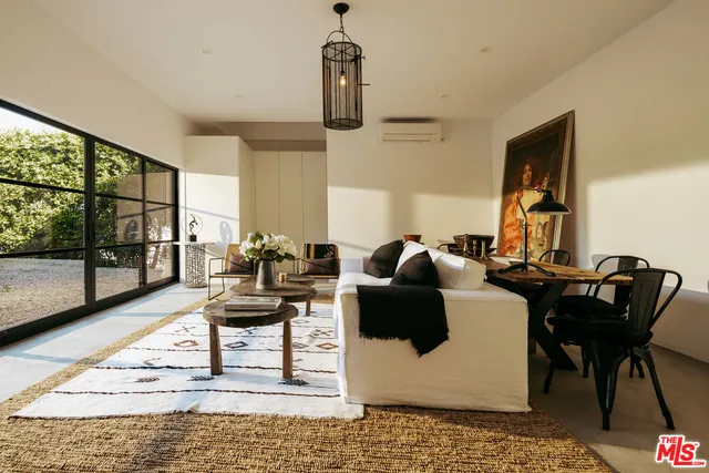 a view of a chair and table in the patio