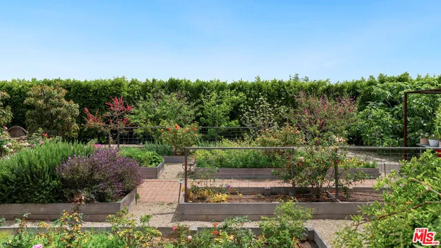 an aerial view of residential houses with outdoor space and swimming pool