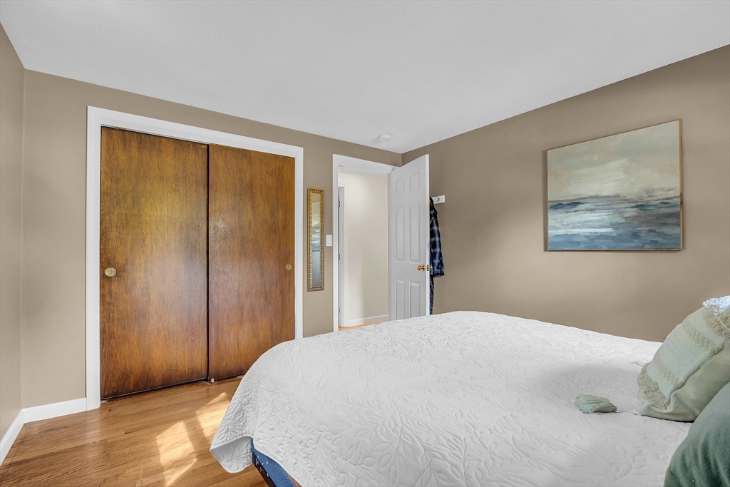 1 Hy Road Westminster, MA 01473 - Photo 26 of 42 a bedroom with a bed and a painting on the wall