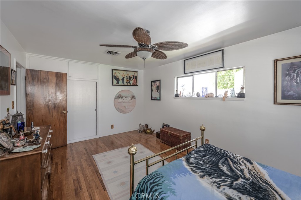 10343 Helendale Avenue Tujunga, CA 91042 - Photo 14 of 30 a room with wooden floor and window
