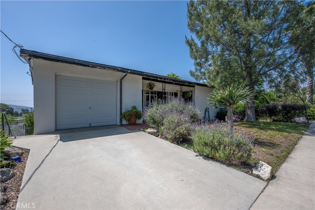 10343 Helendale Avenue Tujunga, CA 91042 - Photo 2 of 30 a backyard of a house with plants and trees