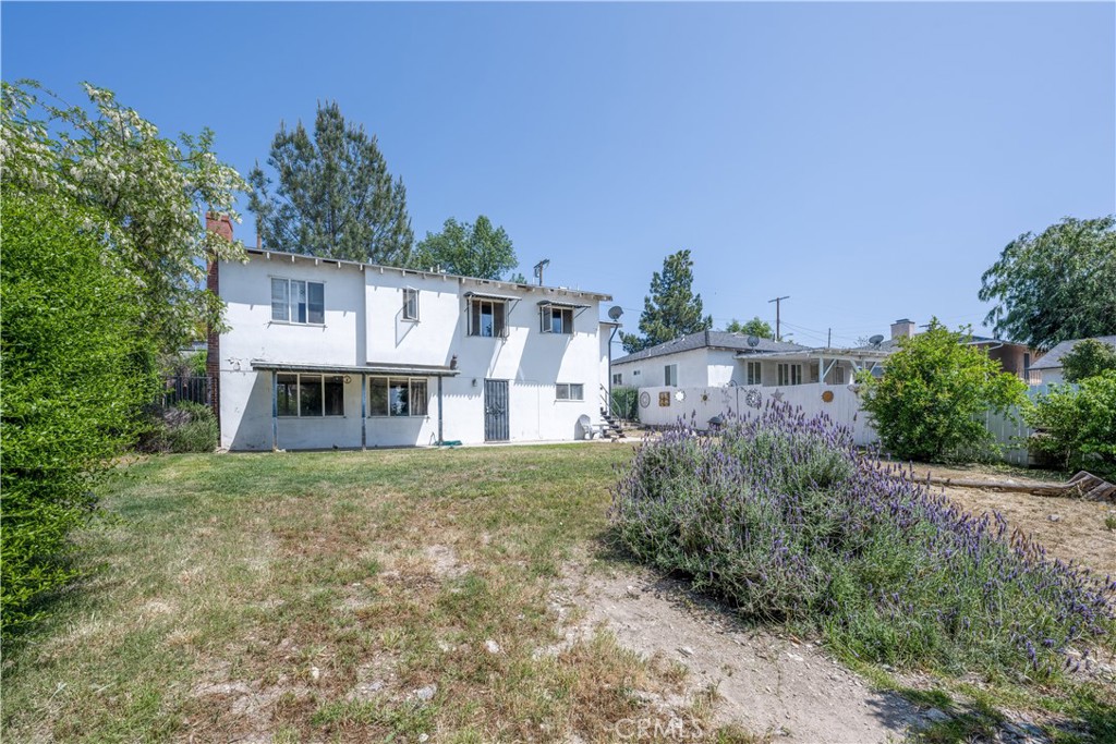 10343 Helendale Avenue Tujunga, CA 91042 - Photo 4 of 30 a front view of a house with a yard