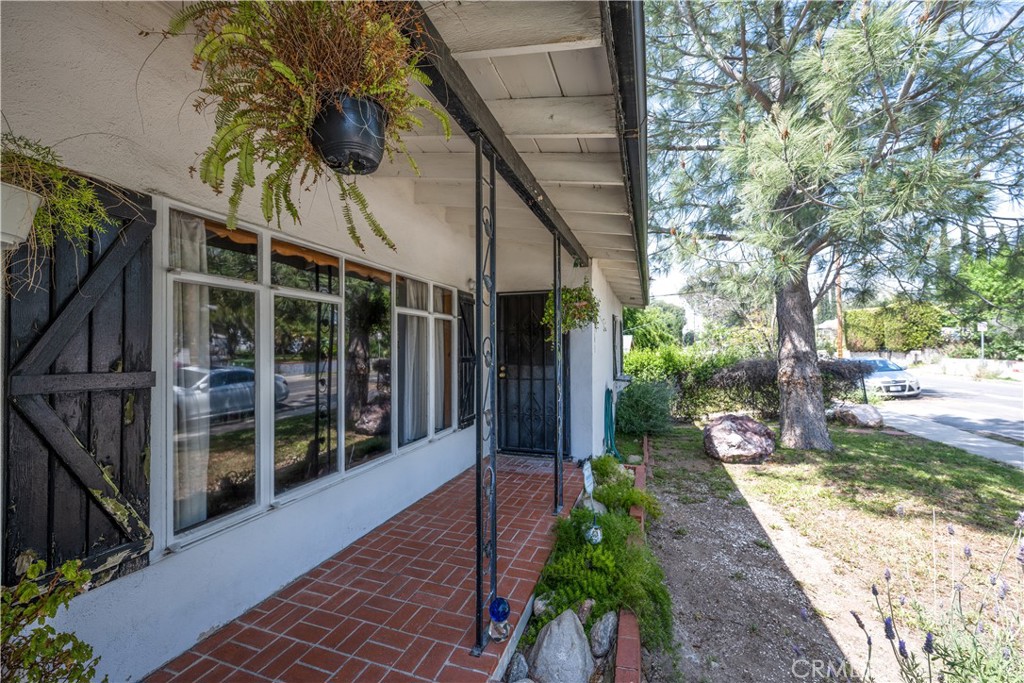 10343 Helendale Avenue Tujunga, CA 91042 - Photo 5 of 30 a view of a pathway of a house with a patio