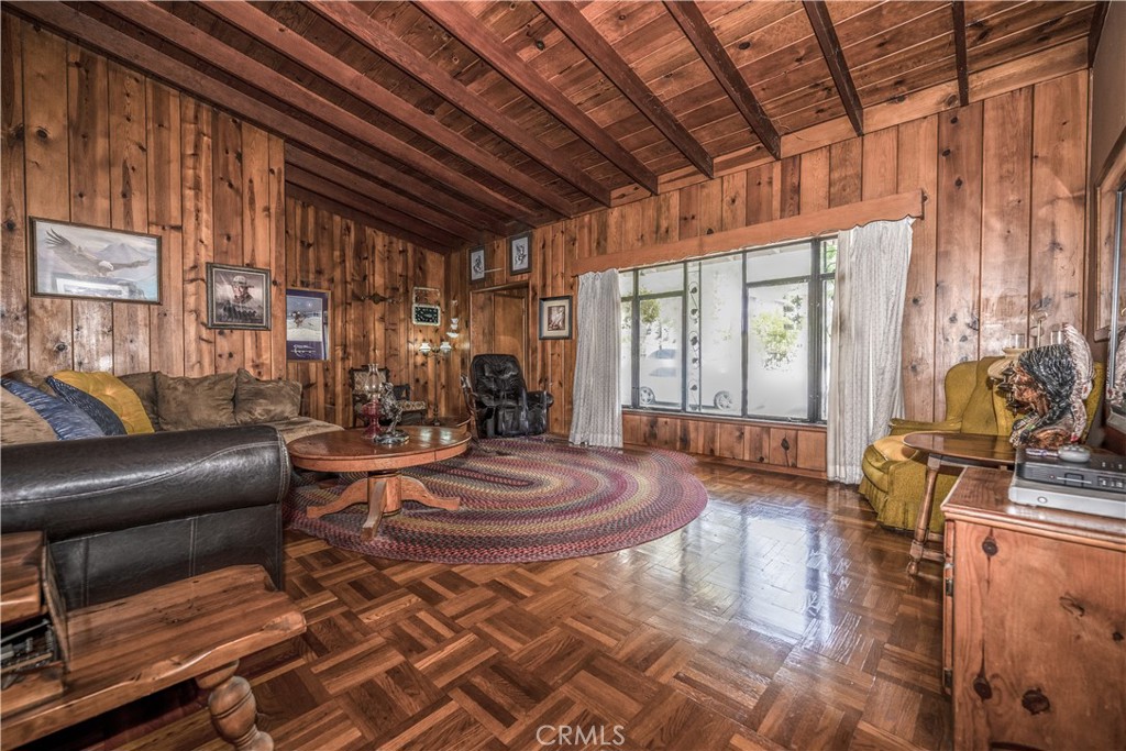 10343 Helendale Avenue Tujunga, CA 91042 - Photo 6 of 30 a living room with furniture a large window and wooden floor