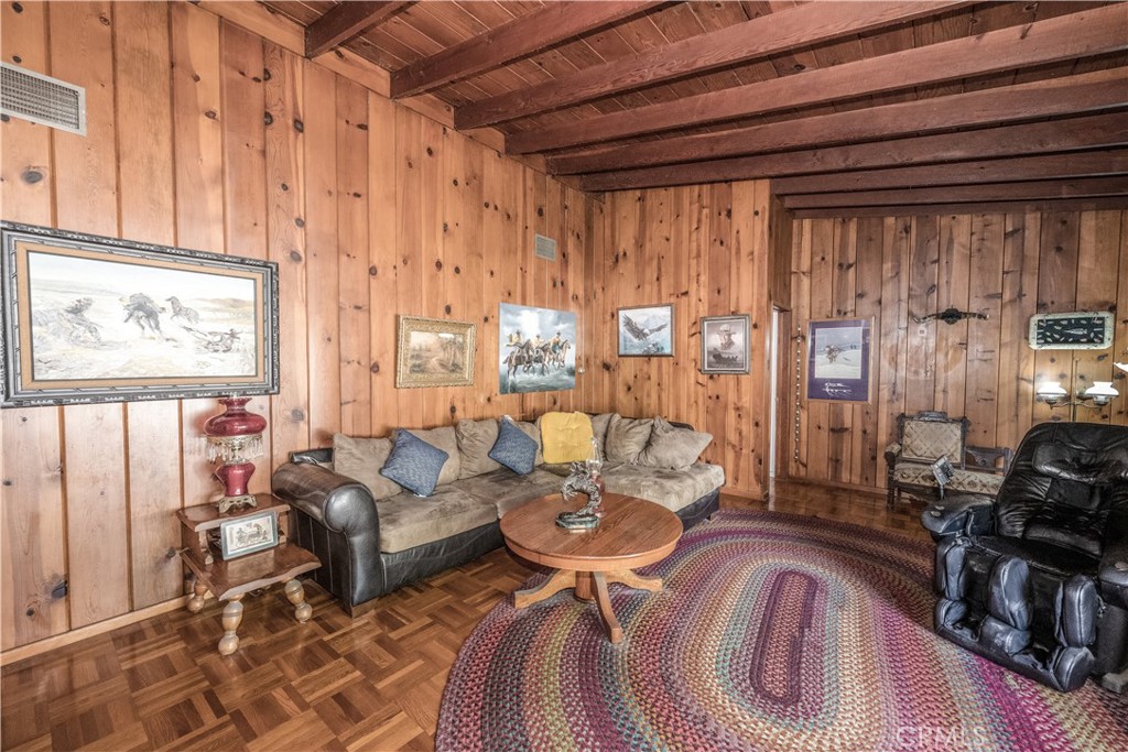10343 Helendale Avenue Tujunga, CA 91042 - Photo 9 of 30 a living room with furniture and large windows