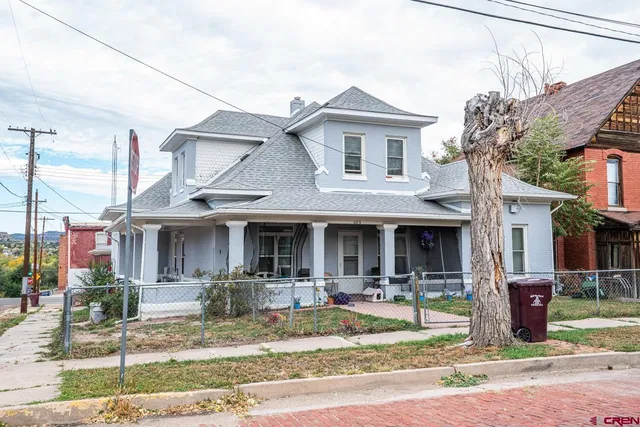 a front view of a building with garden