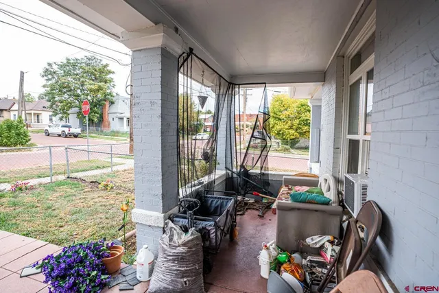 a view of balcony with furniture