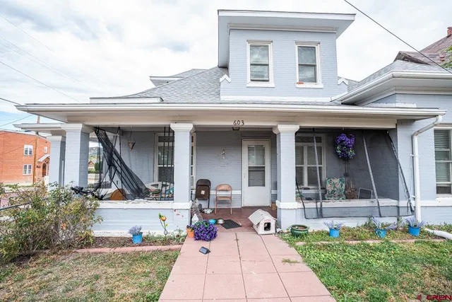 a bench is sitting in front of house