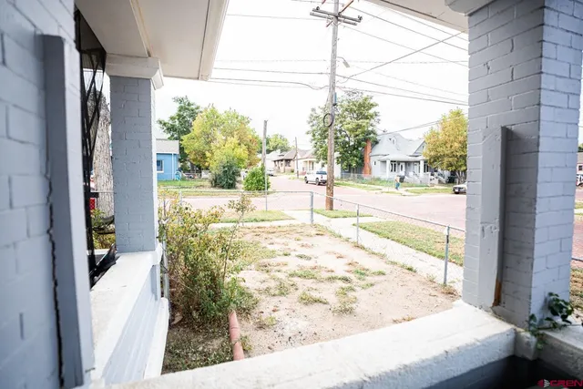 a view of a floor to ceiling window and wooden floor
