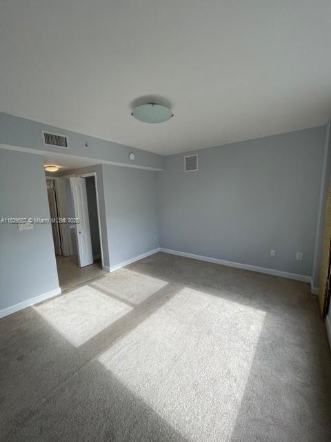 2650 Southwest 37th Avenue, Unit 501 Miami, FL 33134 - Photo 12 of 16 a view of an empty room with a window