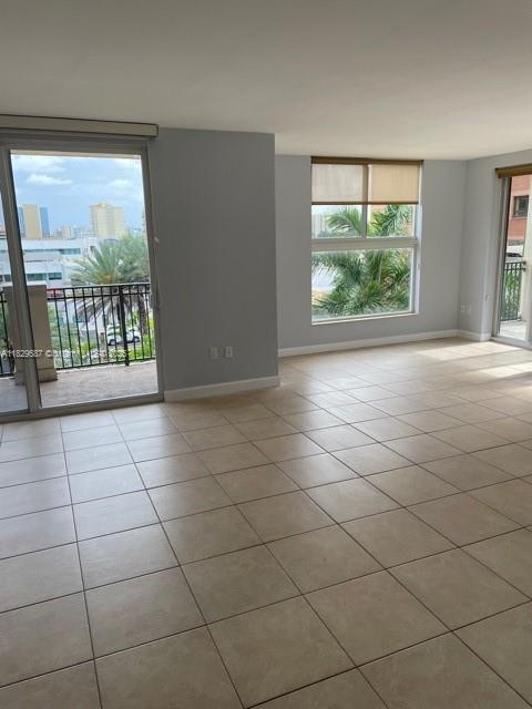 2650 Southwest 37th Avenue, Unit 501 Miami, FL 33134 - Photo 3 of 16 en empty room with windows and entrance