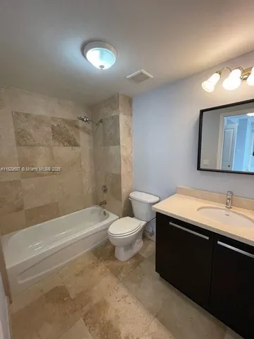 a bathroom with a sink a toilet and a bathtub