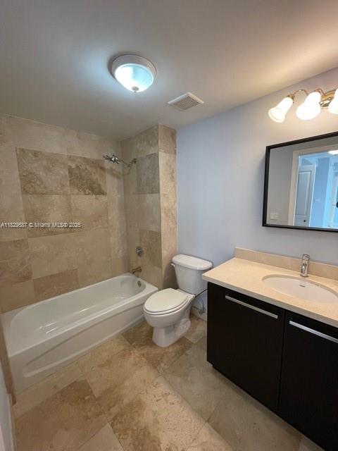 2650 Southwest 37th Avenue, Unit 501 Miami, FL 33134 - Photo 6 of 16 a bathroom with a sink a toilet and a bathtub