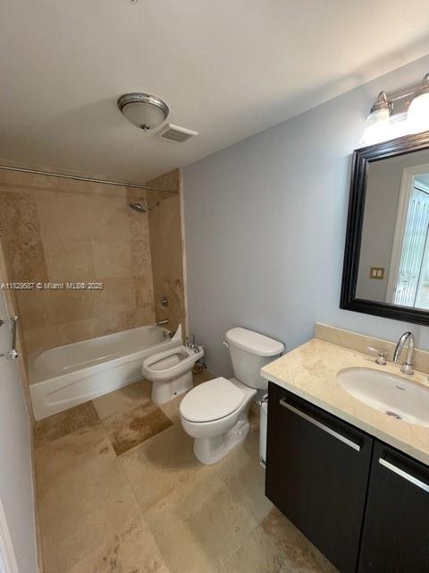 2650 Southwest 37th Avenue, Unit 501 Miami, FL 33134 - Photo 8 of 16 a bathroom with a sink a toilet and shower