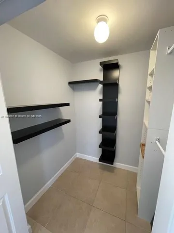 a view of an empty walk in closet