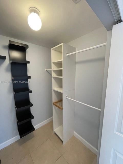 2650 Southwest 37th Avenue, Unit 501 Miami, FL 33134 - Photo 10 of 16 a view of walk in closet with empty racks
