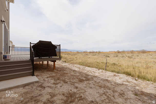 540 Lefty Lane Tooele, UT 84074 - Photo 31 of 48 View of yard featuring a deck