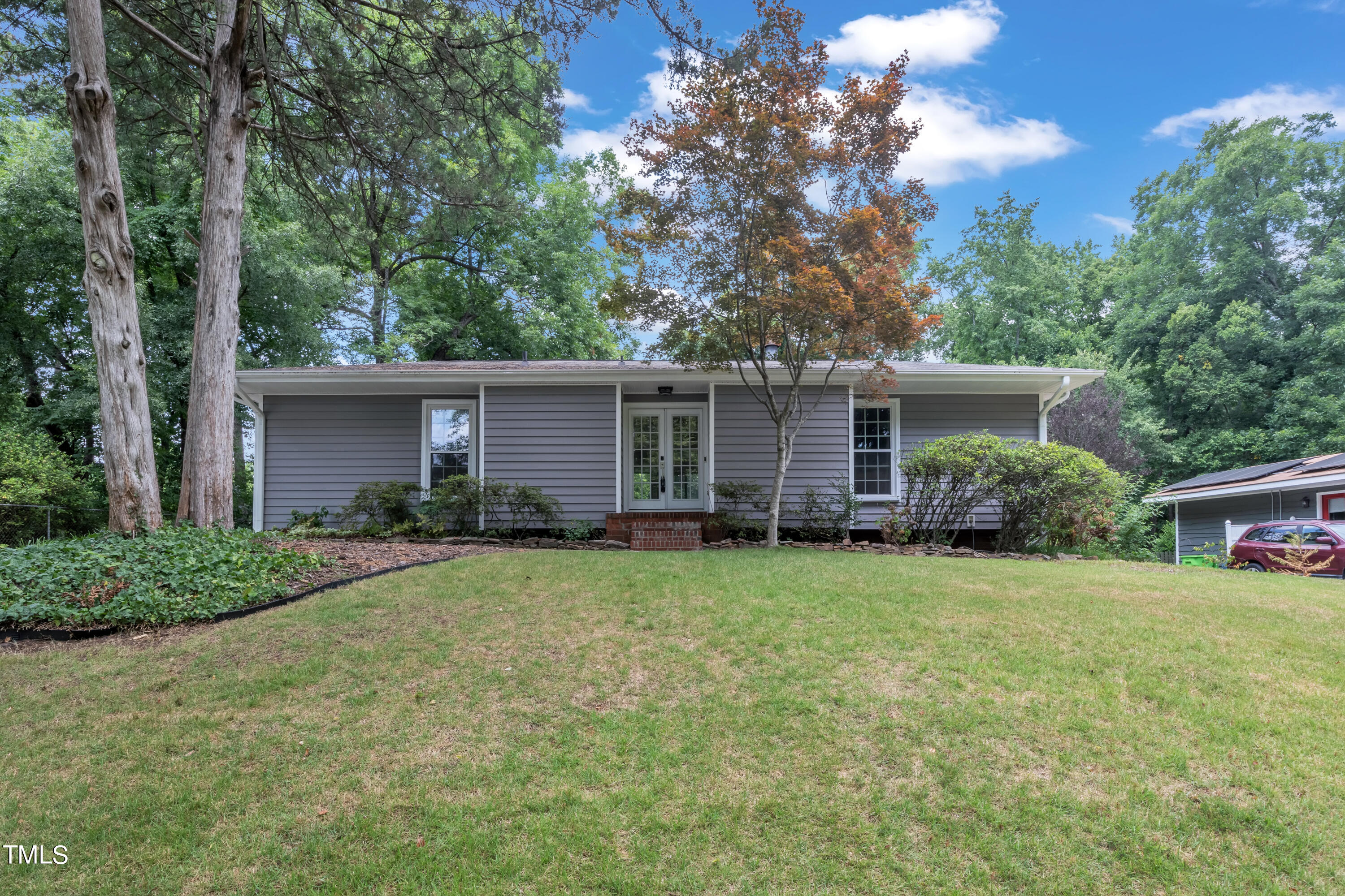 1213 Falls Church Road Raleigh, NC 27609 - Photo 3 of 36 front view of a house and a yard