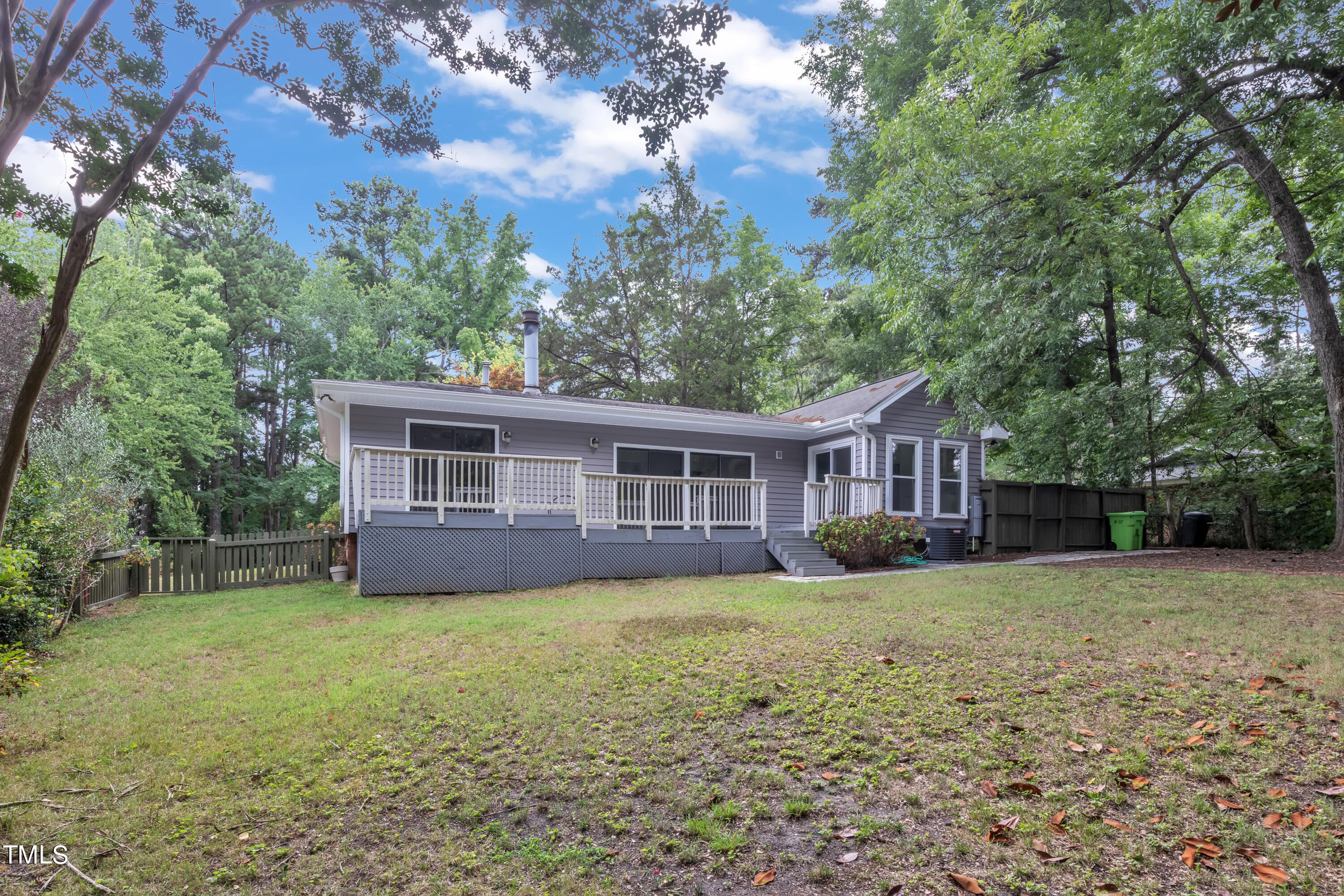 1213 Falls Church Road Raleigh, NC 27609 - Photo 33 of 36 a view of a house with a yard and large trees