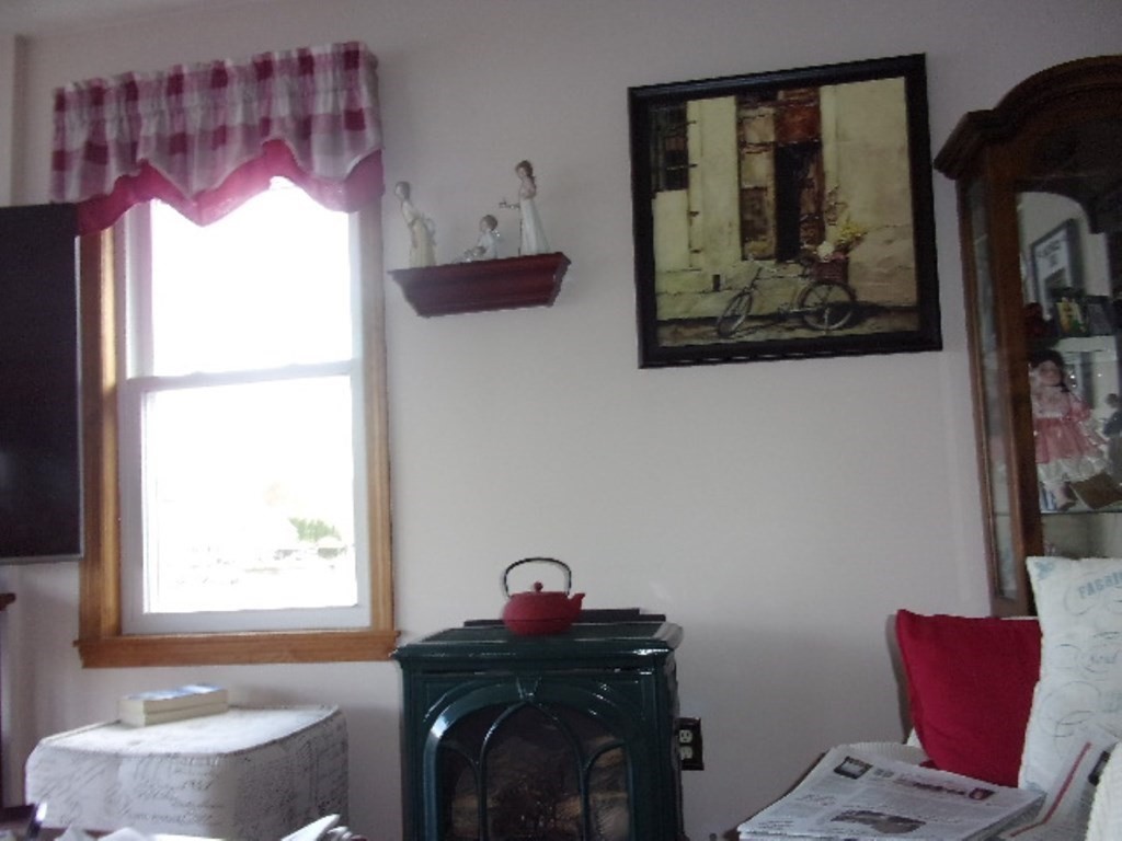 18-20 Conduit Street Lawrence, MA 01841 - Photo 11 of 23 a bathroom with a mirror and a painting on the wall