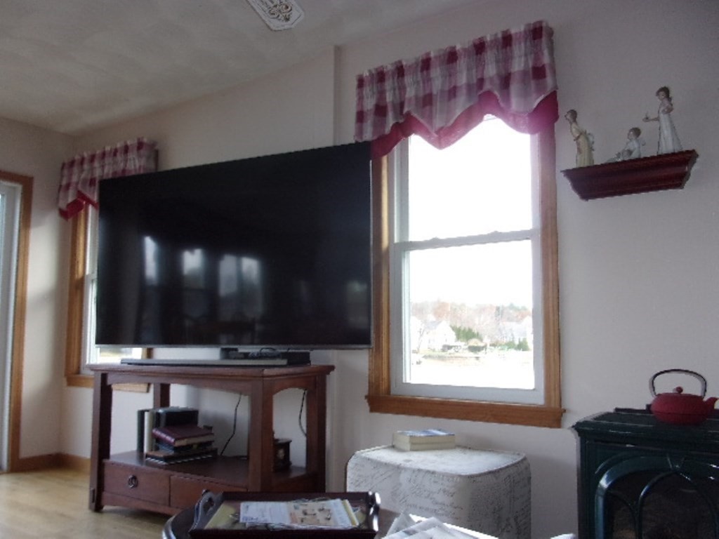 18-20 Conduit Street Lawrence, MA 01841 - Photo 12 of 23 a living room with furniture and a flat screen tv