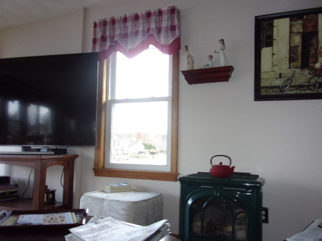 18-20 Conduit Street Lawrence, MA 01841 - Photo 13 of 23 a living room with furniture and a fireplace