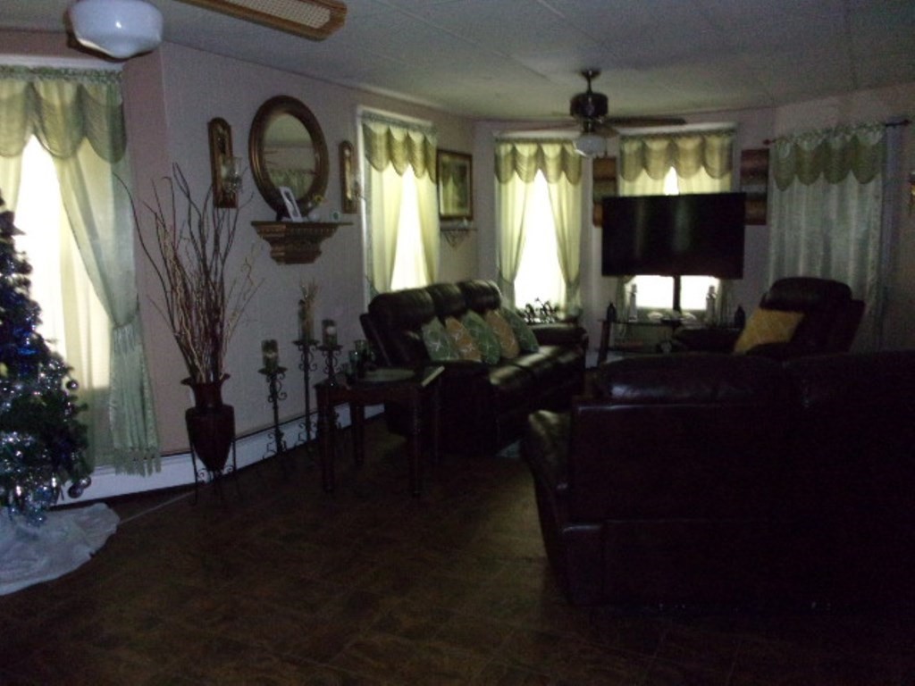 18-20 Conduit Street Lawrence, MA 01841 - Photo 14 of 23 a living room with furniture and a large window