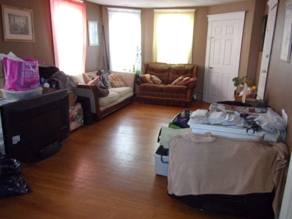 18-20 Conduit Street Lawrence, MA 01841 - Photo 16 of 23 a living room with furniture and a large window