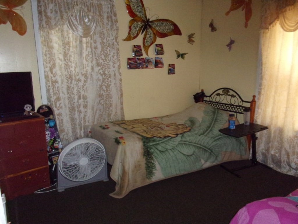 18-20 Conduit Street Lawrence, MA 01841 - Photo 17 of 23 a bedroom with a bed and a window
